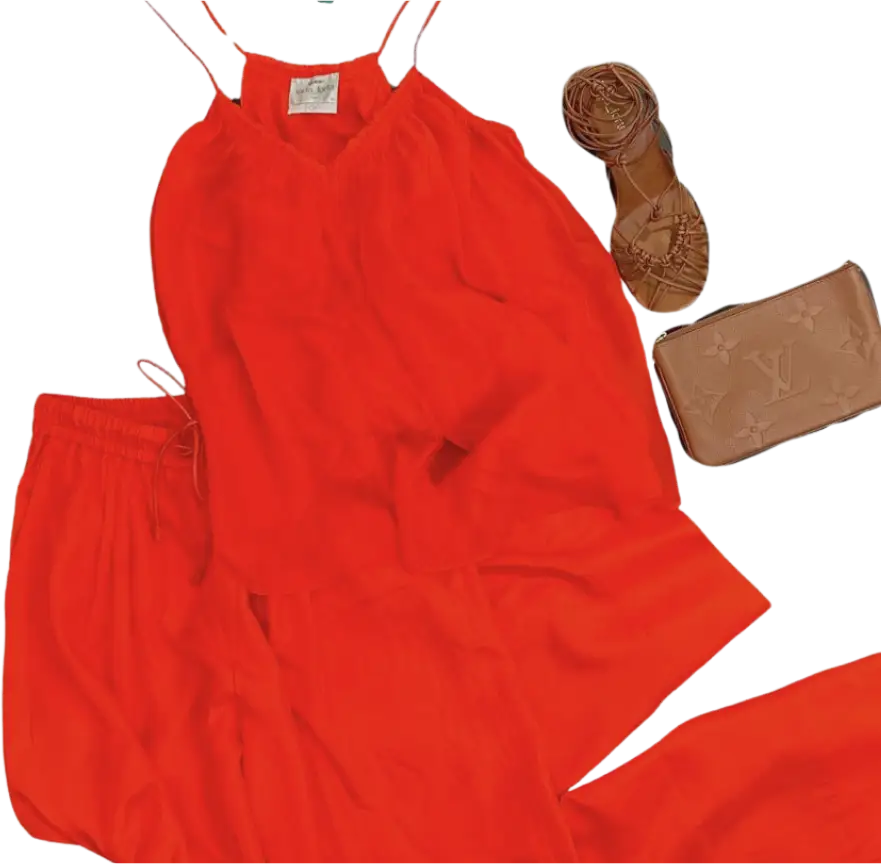 red outfit laid out with shoes and clutch